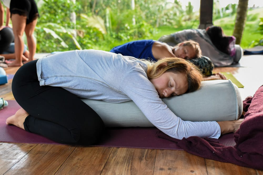 Yoga teacher training students practicing relaxation